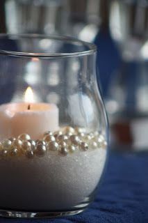 Sand, candle, pearls